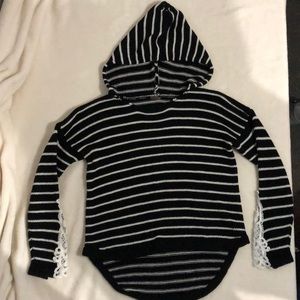 A sweater with a hood